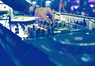 DJ mixing desk at party