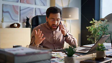 Worried entrepreneur arguing phone call in office closeup. Manager shouting cell