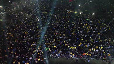 Aerial video of football fans watching football World Cup in the giant screen.