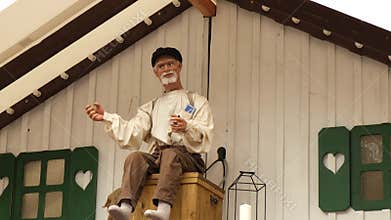 Gdansk, Trojmiasto, Poland - 9 August 2022. Doll decoration calling People gathered at commercial and cultural