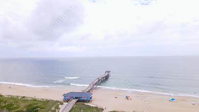 An aerial view of a fishing pier and the ocean in the town of Avon, North Carolina.