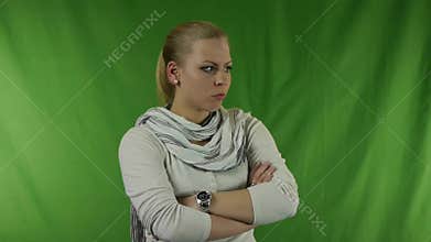 Young upset girl with a watch hands on his hands.