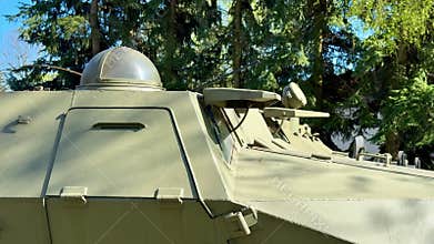 A detailed closeup view of a military vehicle showcasing its turret and various armament features
