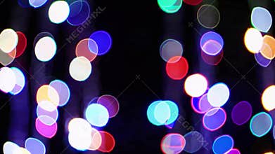 Colorful bokeh lights illuminating the darkness, creating a vibrant, festive atmosphere filled with magic, ideal for celebrations