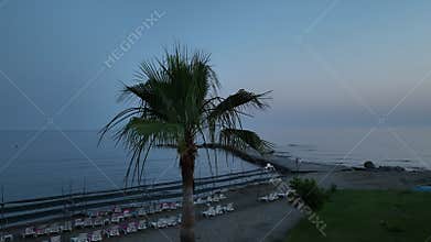 Stunning aerial sunset to night transition over Turkler in Alanya, Turkey. Alanya coastline,resorts,marina,hotels and city lights