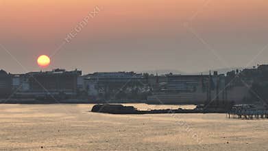 Stunning aerial sunset to night transition over Turkler in Alanya, Turkey. Alanya coastline,resorts,marina,hotels and city lights