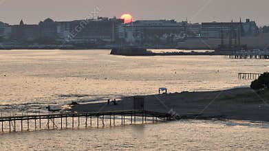 Stunning aerial sunset to night transition over Turkler in Alanya, Turkey. Alanya coastline,resorts,marina,hotels and city lights