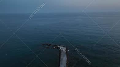 Stunning aerial sunset to night transition over Turkler in Alanya, Turkey. Alanya coastline,resorts,marina,hotels and city lights