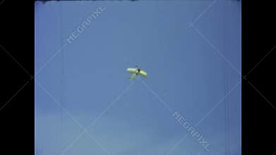 Vintage biplane performing aerobatics in the sky