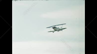 Vintage biplane performing aerobatics in the sky