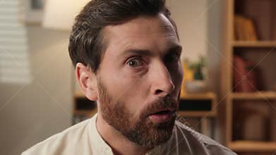 Caucasian man portrait at home shocked guy looking new interesting amazing reaction close up male face shock stunned big