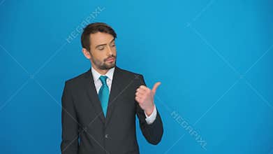 Handsome businessman pointing his thumb