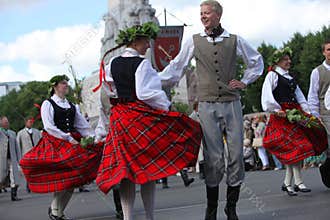 RIGA, LATVIA - JULY 07: People in national costumes at the Latvian National Song and Dance Festival on July 07, 2013. Holiday was