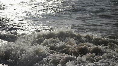 Two boys dive into a foaming wave. Live a healthy life. Be H3althy