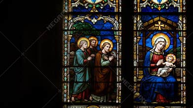 Colorful Stained Glass Window Depicting Religious Scene with Jesus and Apostles in Bright Lighting