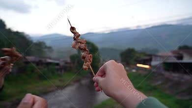 Thai Street Food: BBQ Chitterlings Skewers , Grilled Pork Intestines on Skewers