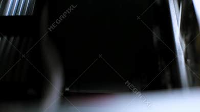 The process of printing a color inkjet printer in close-up. The rolles is rolling inside of device and printed a picture