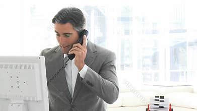 Charming business man talking on phone
