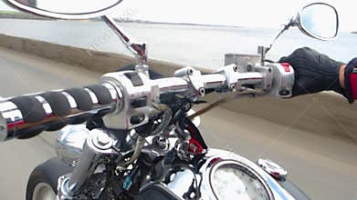 Motorcycle rides along the coast. Black matte motorcycle with chrome details.