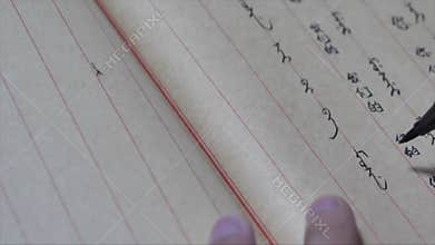 Close shot of Chinese manchu language Calligraphy writing