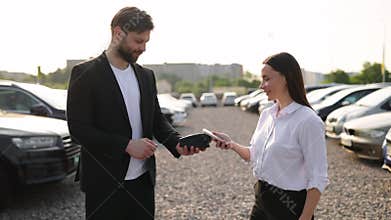 Car Dealer Selling Car to a Woman