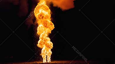 Intense explosion with fiery flames and smoke rising dramatically against dark background