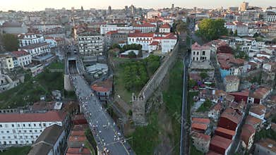 Medieval stone walls towers built as fortifications, with scenic views of the city and river. Porto City, Portugal, drone, 4k