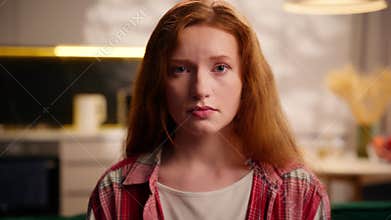 Portrait at home indoors apartment dissatisfied upset frustrated Caucasian woman female girl lady bad mood moody frown