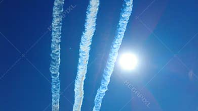 Aerobatics of an air group against a blue sky.