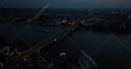 Erial drone footage of Bonn, Germany, captured at dusk, highlighting urban cityscapes.