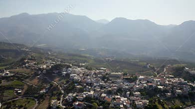 Aerial view of Agios Myronas Village on a sunny day in the Heraklion regional unit of Crete, Greece