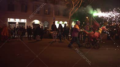 Barcelona, Spain - 20 January 2025: traditional catalan Correfoc, people dressed as devils with firecrackers, in slow motion