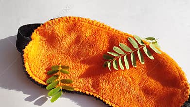 Camera movement over a soft orange eye mask lying 4k video.