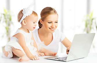 Mom and baby with computer working from home