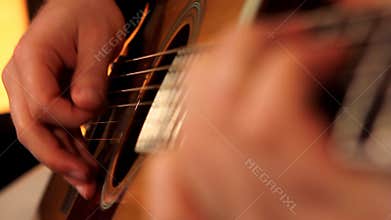 man playing guitar close up 3