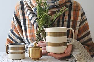 vintage beer mug hold by hand on pub background
