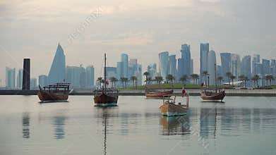 Traditional Arabic Dhow boats in Doha harbour, Qatar. beautiful seascape with sea and modern skyscrapers on the