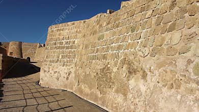 tourist walking in Qal'at al-Bahrain fort