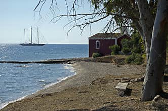 Spetses (14) 06-2012 Kaiki beach at Kounoupitsa with red church