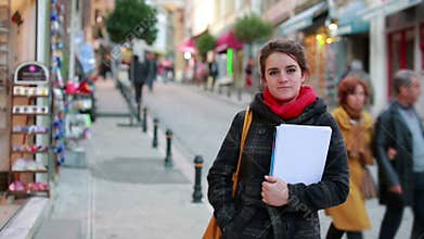 female student holding books