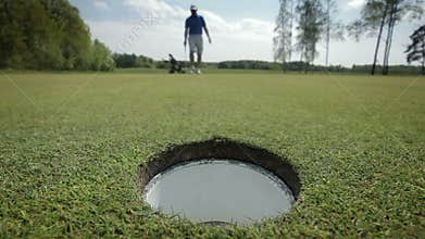 Ball rolling into the hole