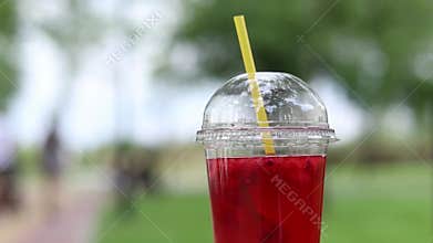 Lemonade in a disposable plastic cup, takeaway drink