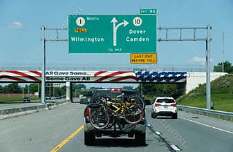 Dover, Delaware, U.S - June 2, 2025 - Traffic on Route 1 North, marked by exit signs to Wilmington, Dover and Camden, including