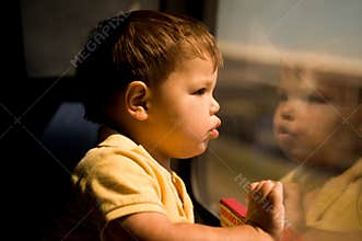 Adorable little boy on the train