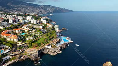 erial drone footage of the coastal city of Funchal, Madeira, Portugal.
