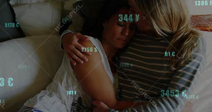 On finance update companion holding upset partner tighter on sofa while currency values drifting