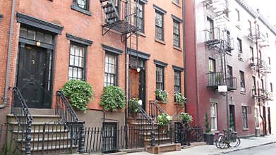 New York City building architecture. Urban residential house exterior. Real estate. Red brick facade