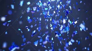 Shiny blue confetti falling against a dark blue background creating a festive atmosphere perfect for celebrations, holidays