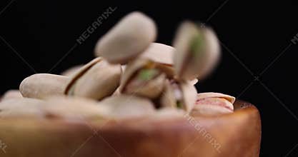 fried pistachio nuts in their shells with added salt
