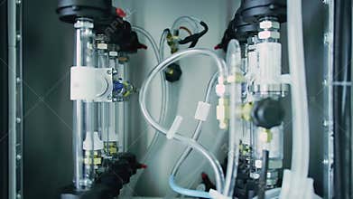Anesthesia Gas Mixing System Featuring Transparent Tubing Metallic Valves and Black Fixtures in a Clean Sterile Environment
